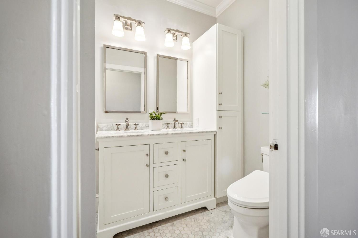 2522 Chestnut Street San Francisco, CA 94123 - Photo 29 of 34 a bathroom with a granite countertop sink toilet and shower