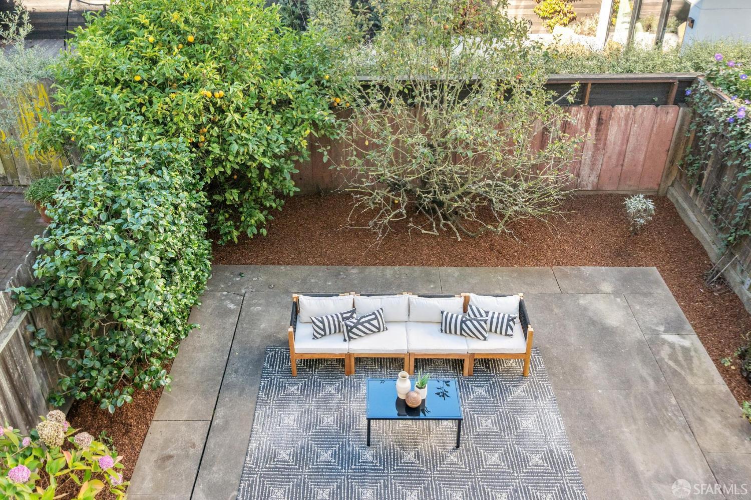 2522 Chestnut Street San Francisco, CA 94123 - Photo 32 of 34 a bench is sitting in the middle of a backyard