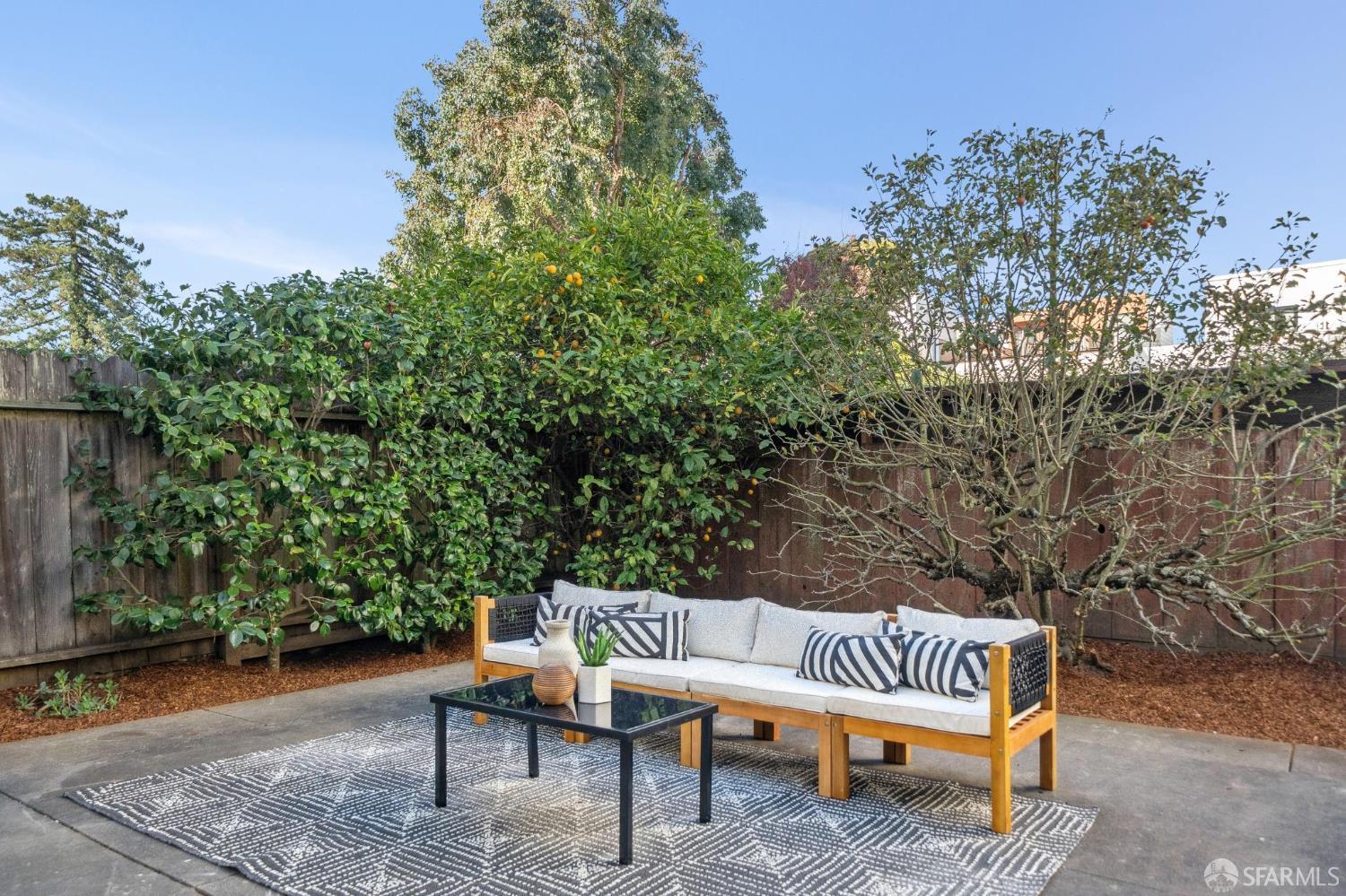 2522 Chestnut Street San Francisco, CA 94123 - Photo 34 of 34 a wooden bench sitting in the middle of a yard