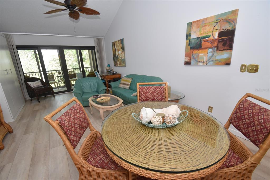 1720 Glenhouse Drive, Unit GL429 Sarasota, FL 34231 - Photo 2 of 34 a living room with furniture and a large window