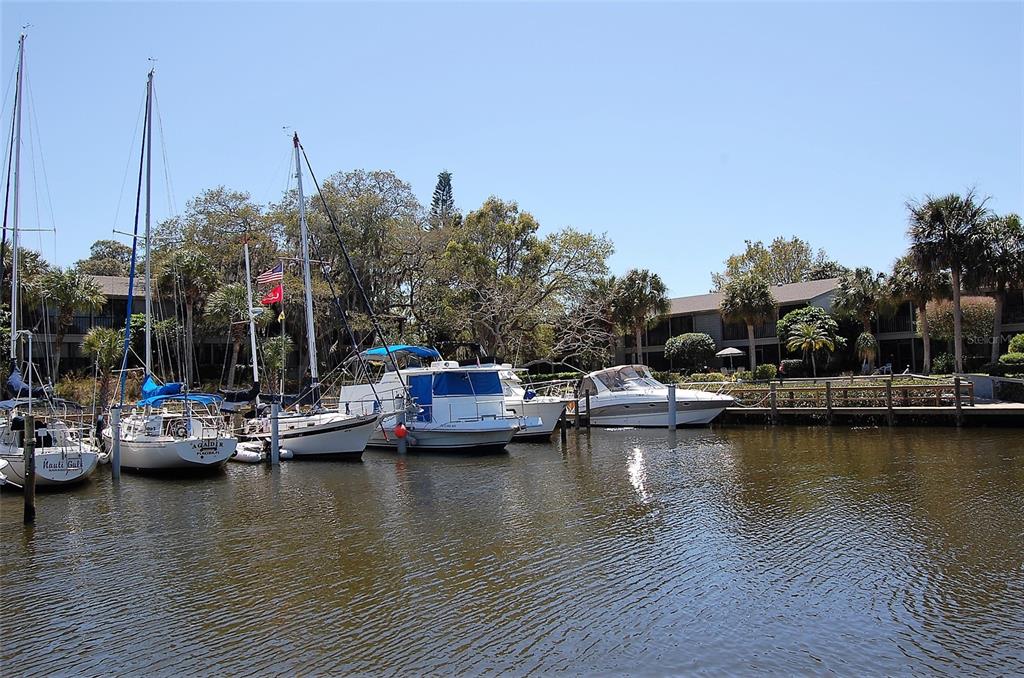 1720 Glenhouse Drive, Unit GL429 Sarasota, FL 34231 - Photo 27 of 34 a view of a lake with boats and trees