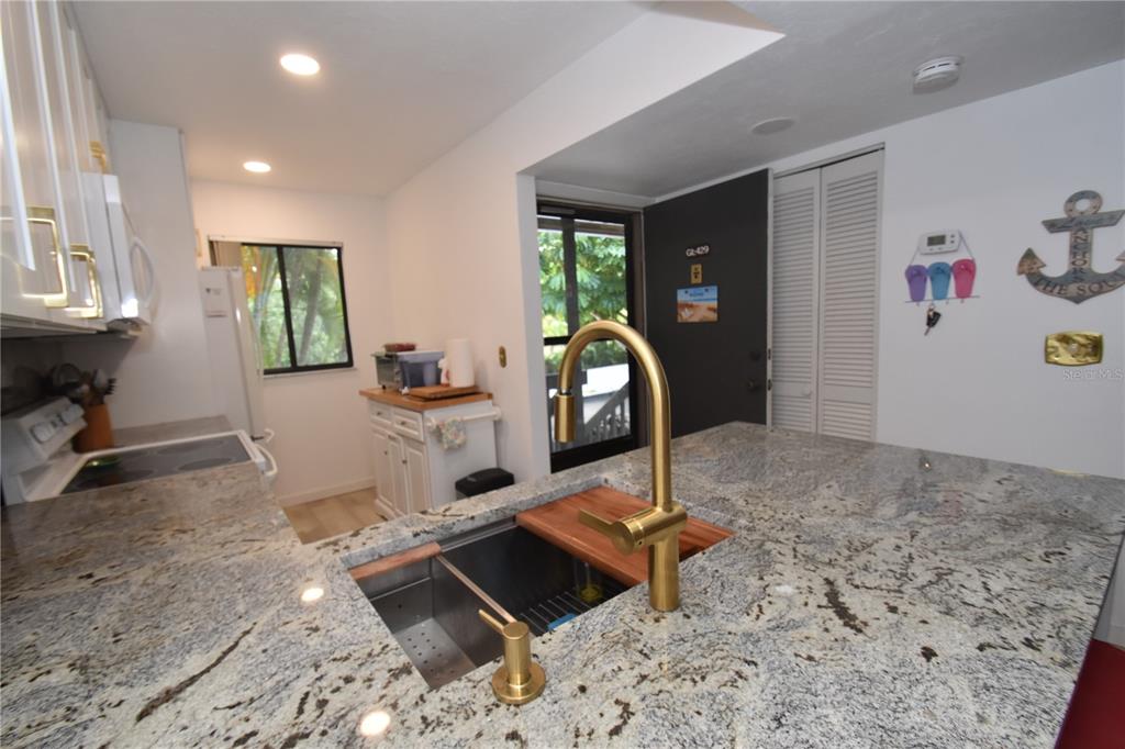 1720 Glenhouse Drive, Unit GL429 Sarasota, FL 34231 - Photo 3 of 34 a view of a room with gym equipment