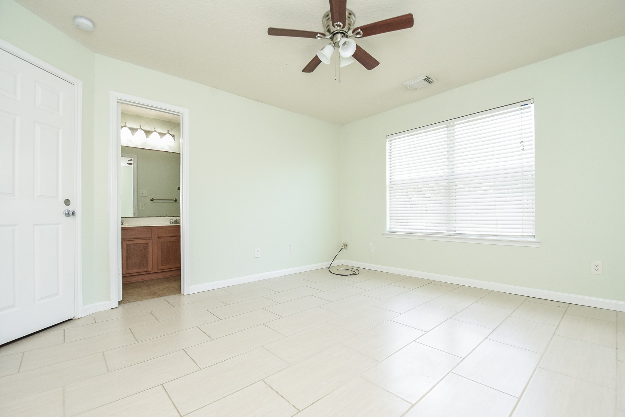 29323 Hickory Terrace Drive Spring, TX 77386 - Photo 17 of 32 Texas sized primary bedroom boasts privacy by overlooking backyard