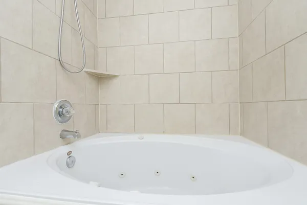 a bathroom with a toilet a sink and a mirror