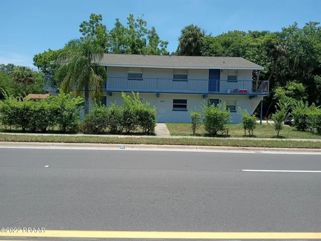 front view of a house with a street