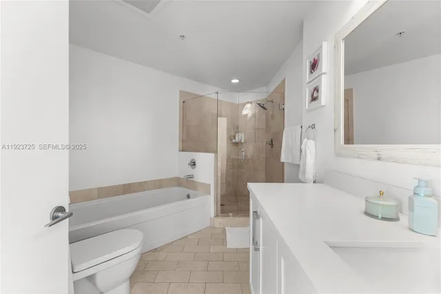 a bathroom with a sink a toilet and a bathtub