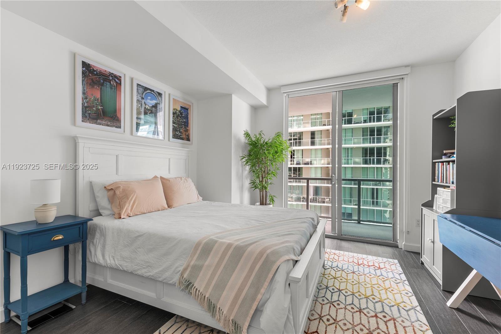 1111 Southwest 1st Avenue, Unit 2614N Miami, FL 33130 - Photo 14 of 32 a bedroom with a large bed and a window