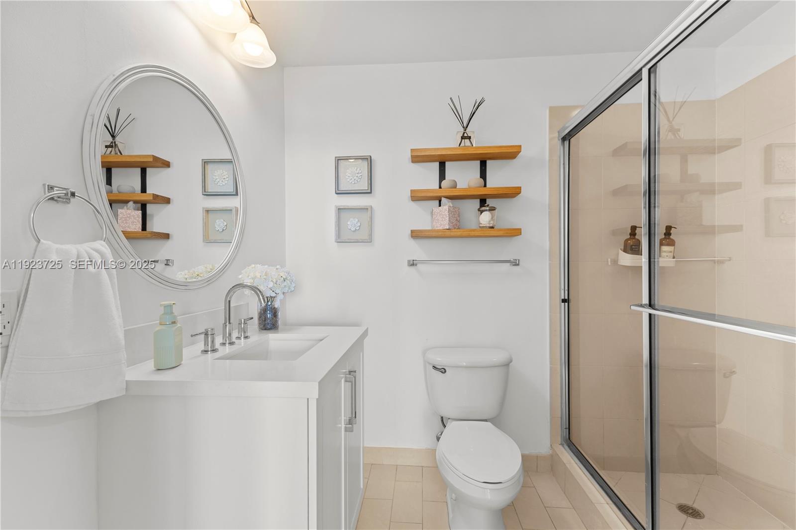 1111 Southwest 1st Avenue, Unit 2614N Miami, FL 33130 - Photo 15 of 32 a bathroom with a sink a toilet and shower