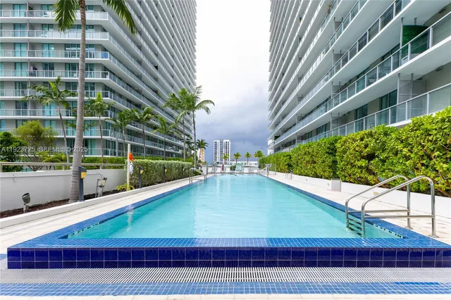 a view of balcony with two chairs and a table