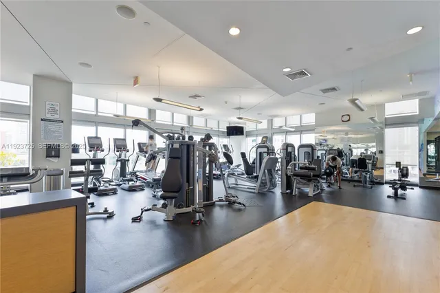 a view of a room with gym equipment and lots of room