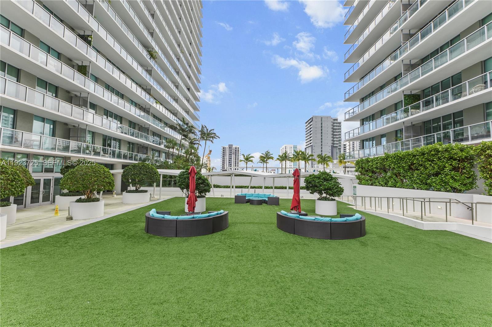 1111 Southwest 1st Avenue, Unit 2614N Miami, FL 33130 - Photo 30 of 32 a front view of a building with a garden