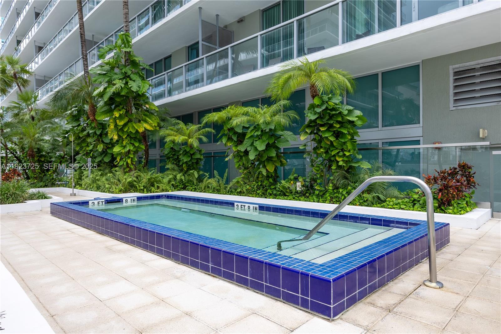1111 Southwest 1st Avenue, Unit 2614N Miami, FL 33130 - Photo 31 of 32 a view of a pool with a bench in front of it