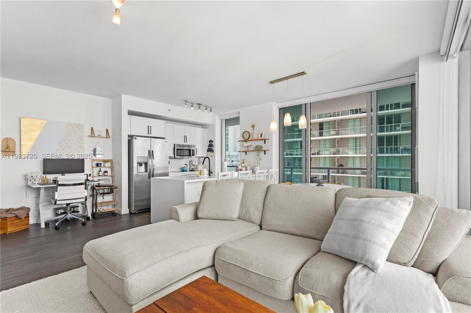 1111 Southwest 1st Avenue, Unit 2614N Miami, FL 33130 - Photo 10 of 32 a living room with furniture and a large window