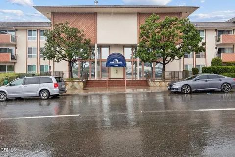 a view of a cars parked in front of a building