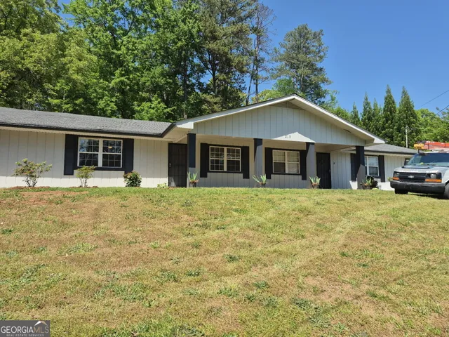a house with trees in the background