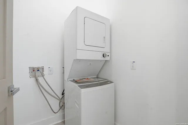 a view of storage and utility room with racks on the wall