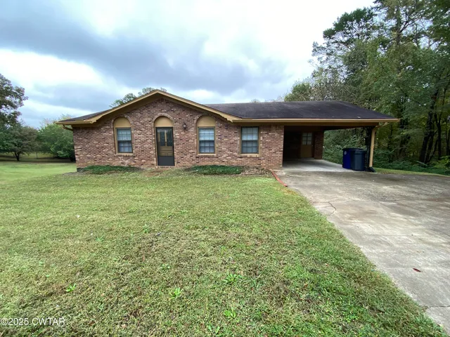 a house view with a garden space