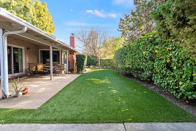 a view of a backyard with a patio