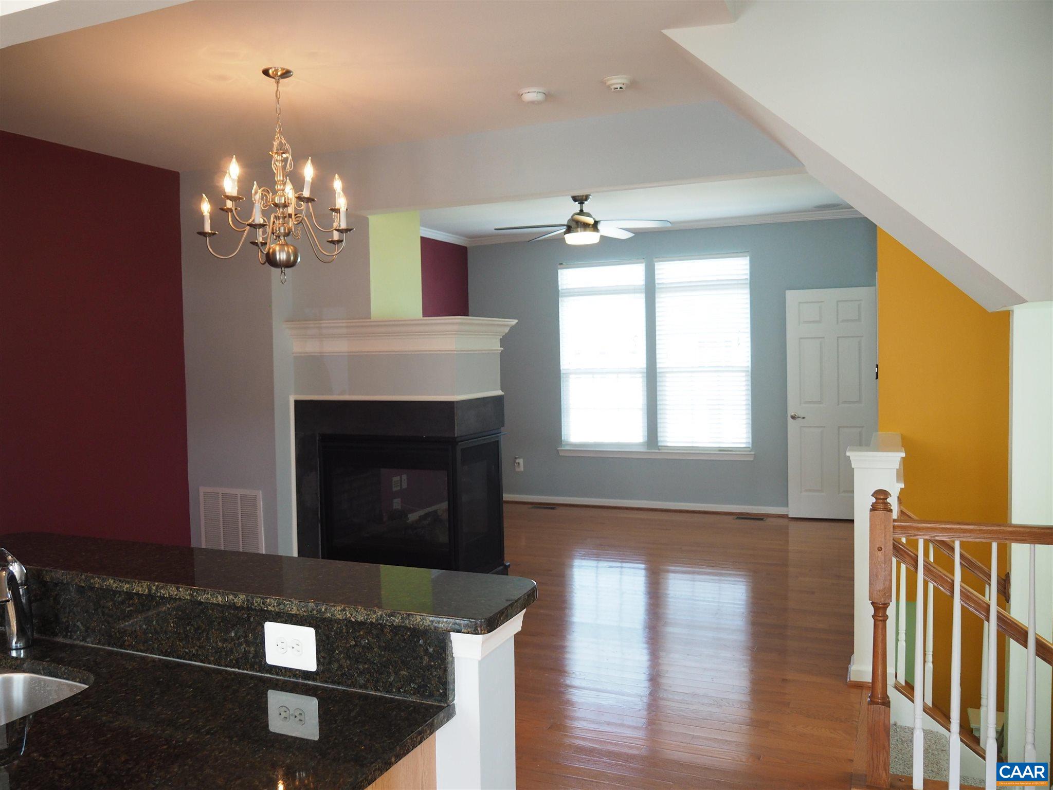 469 Rolkin Road Charlottesville, VA 22911 - Photo 16 of 38 a living room with furniture and a fireplace