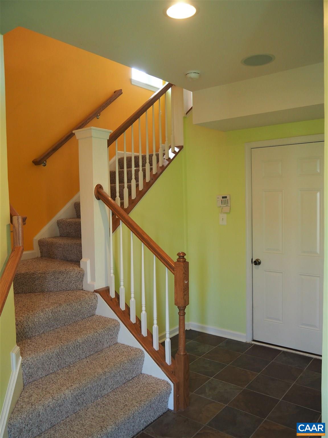 469 Rolkin Road Charlottesville, VA 22911 - Photo 6 of 38 a view of staircase with railing and a rug