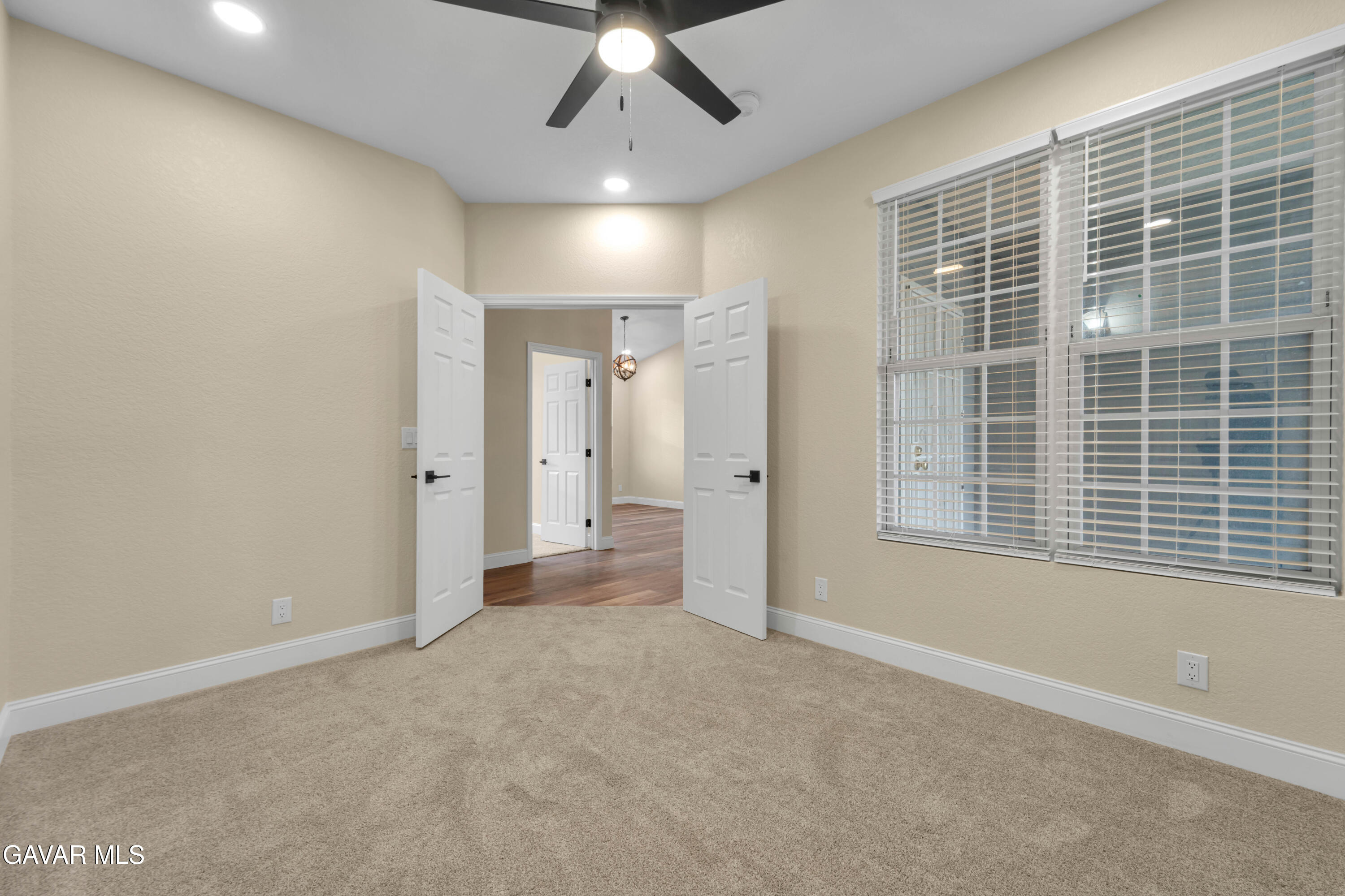 43323 Honeybee Lane Lancaster, CA 93536 - Photo 18 of 32 a view of livingroom with a ceiling fan and window