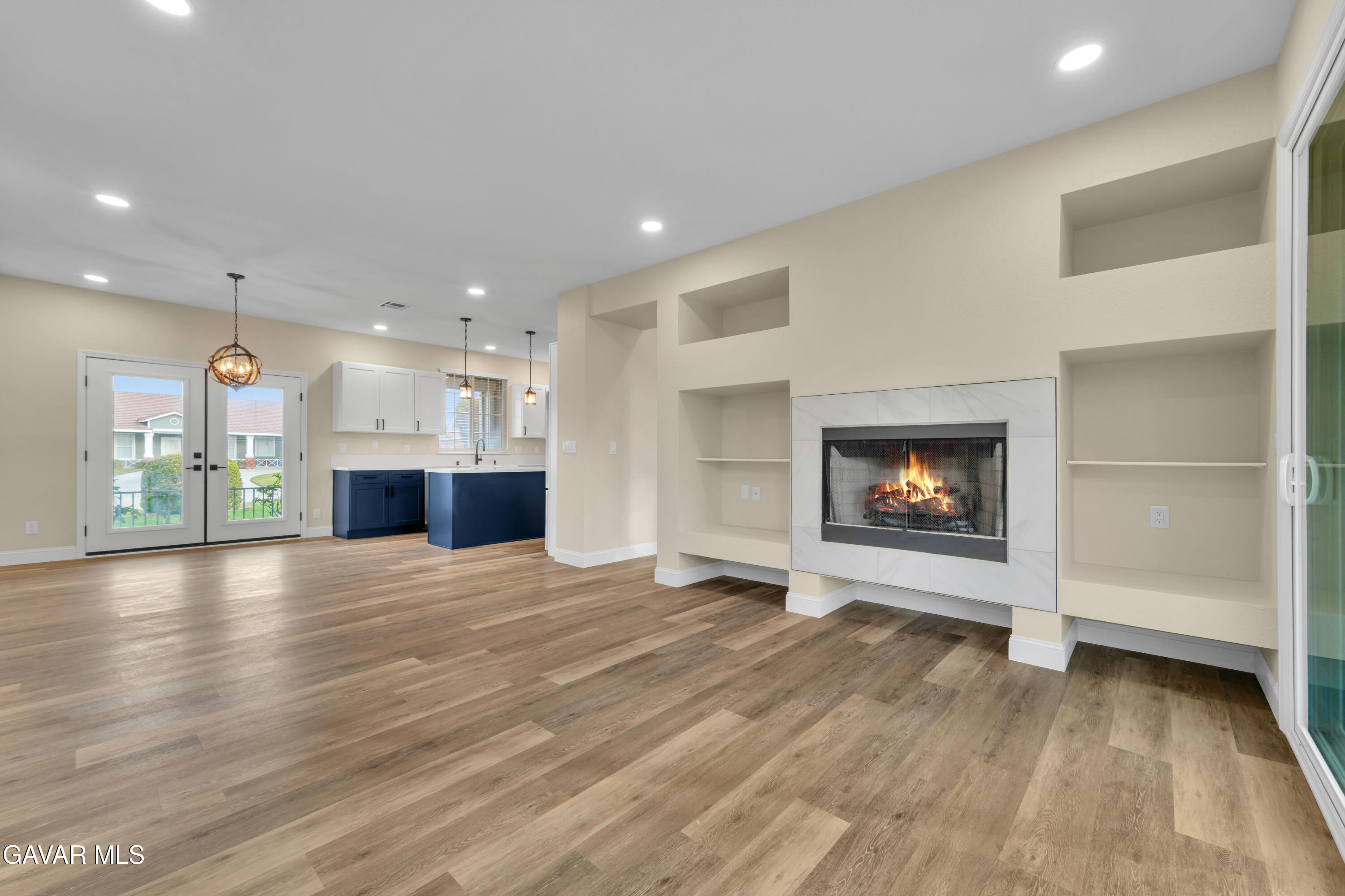 43323 Honeybee Lane Lancaster, CA 93536 - Photo 2 of 32 a view of an empty room with a fireplace and a window