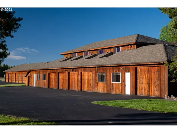 a living room with lots of furniture and a flat screen tv