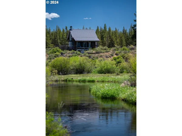a black and white building with black door
