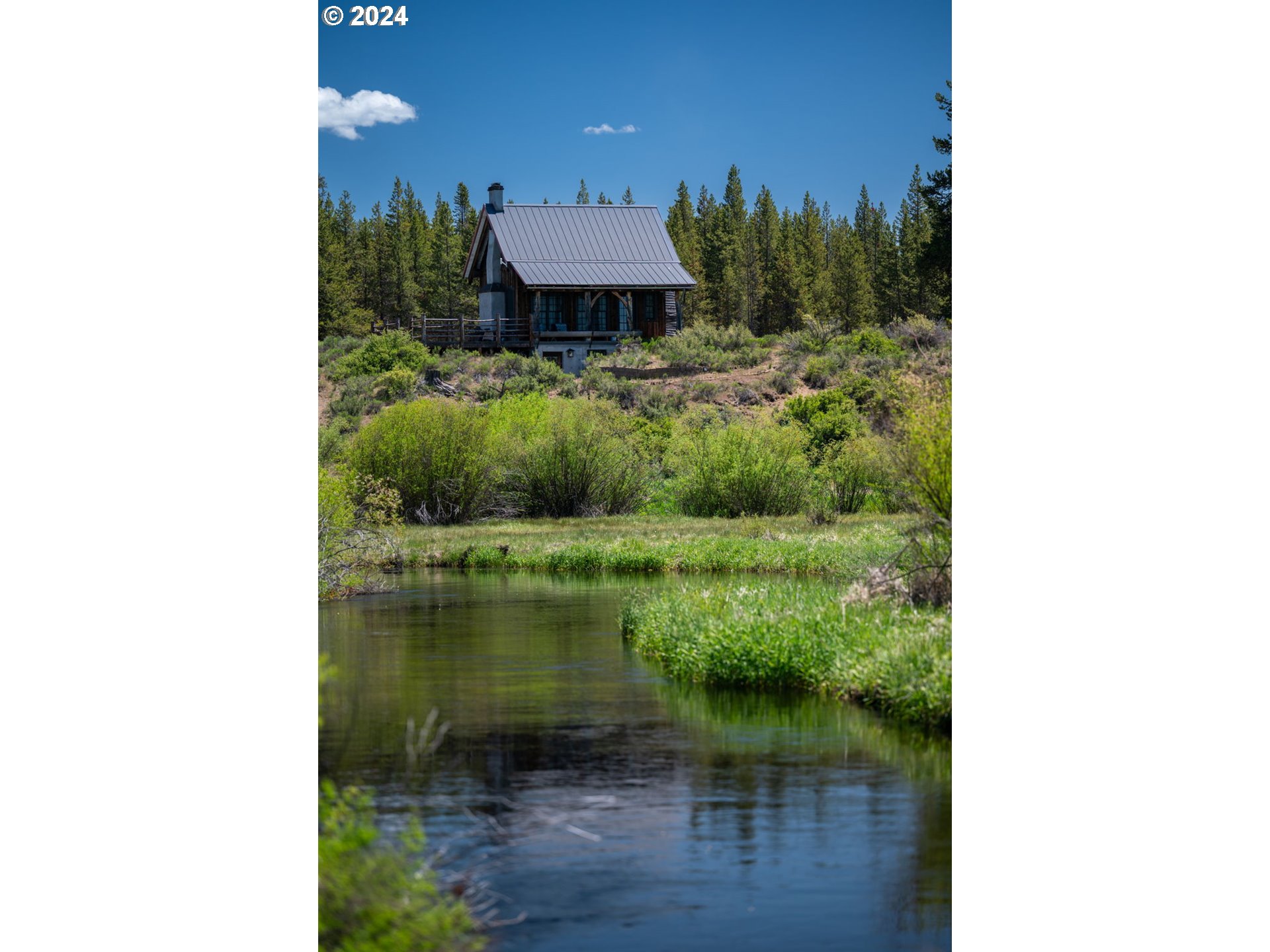 52255 Huntington Road La Pine, OR 97739 - Photo 33 of 48 a picture of a bench in front of house