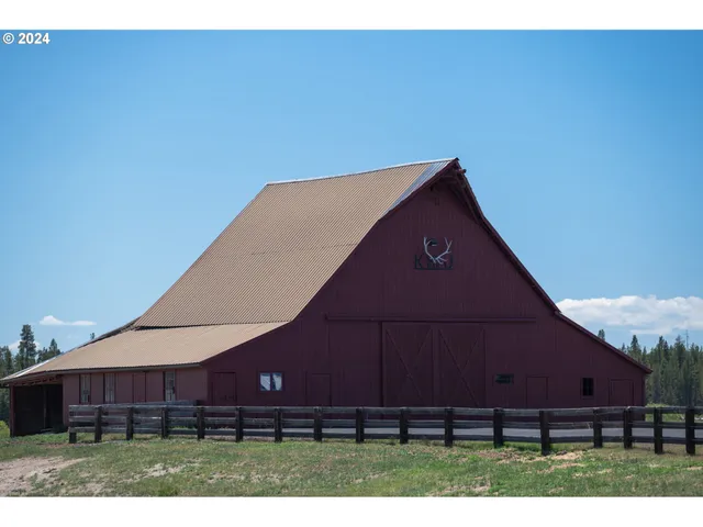 a view of a swimming pool and an outdoor seating
