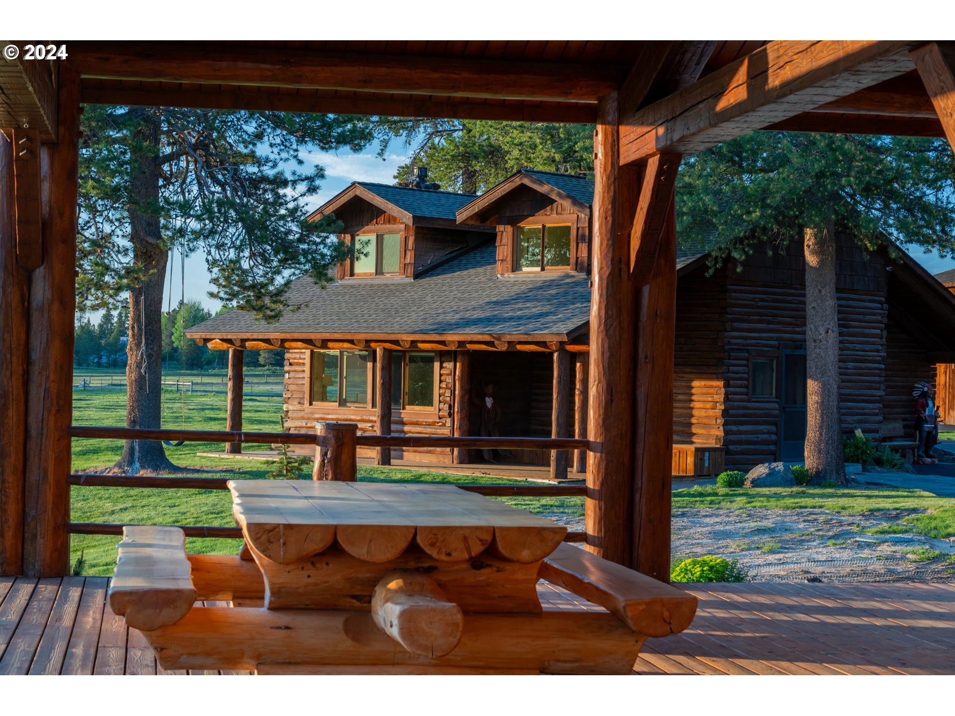 52255 Huntington Road La Pine, OR 97739 - Photo 42 of 48 a view of house with backyard outdoor seating and hardwood
