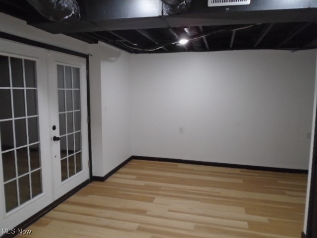 10971 Auburn Road Chardon, OH 44024 - Photo 29 of 40 Finished below grade area featuring french doors and light wood-type flooring