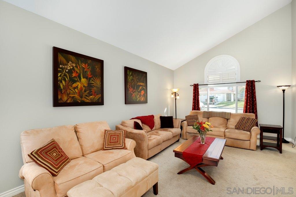 5058 Frazee Road Oceanside, CA 92057 - Photo 2 of 25 a living room with furniture and a large window