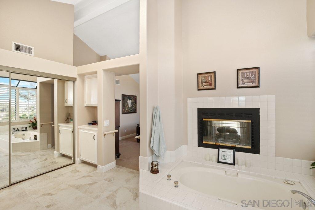 5058 Frazee Road Oceanside, CA 92057 - Photo 11 of 25 a view of a hallway with furniture and front door