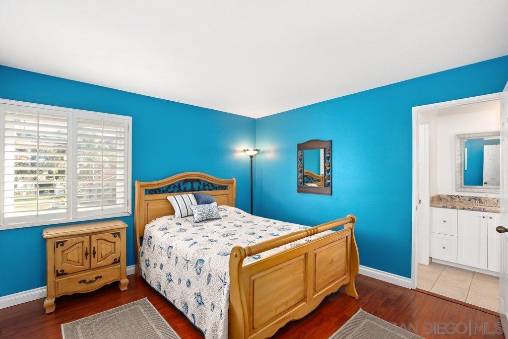 5058 Frazee Road Oceanside, CA 92057 - Photo 14 of 25 a bedroom with a bed and a dresser