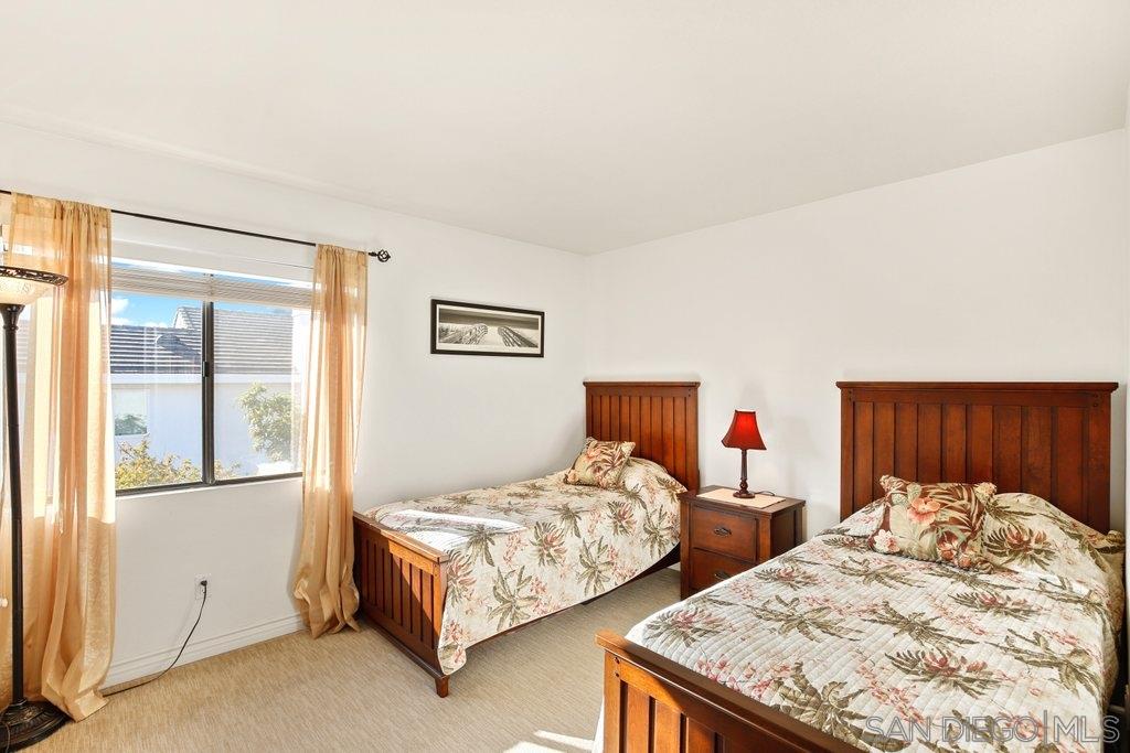 5058 Frazee Road Oceanside, CA 92057 - Photo 16 of 25 a bedroom with two beds and painted walls
