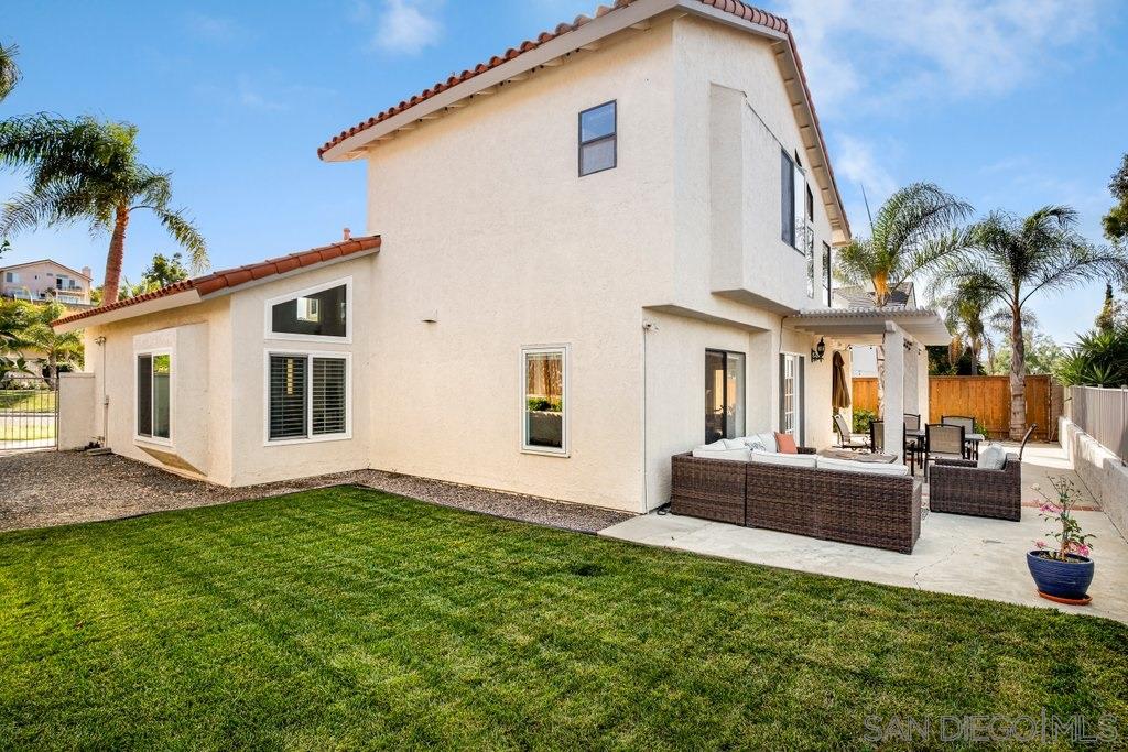 5058 Frazee Road Oceanside, CA 92057 - Photo 19 of 25 a front view of a house with a yard