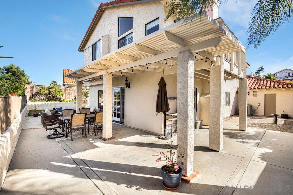 5058 Frazee Road Oceanside, CA 92057 - Photo 22 of 25 a building outdoor space with patio furniture and potted plants