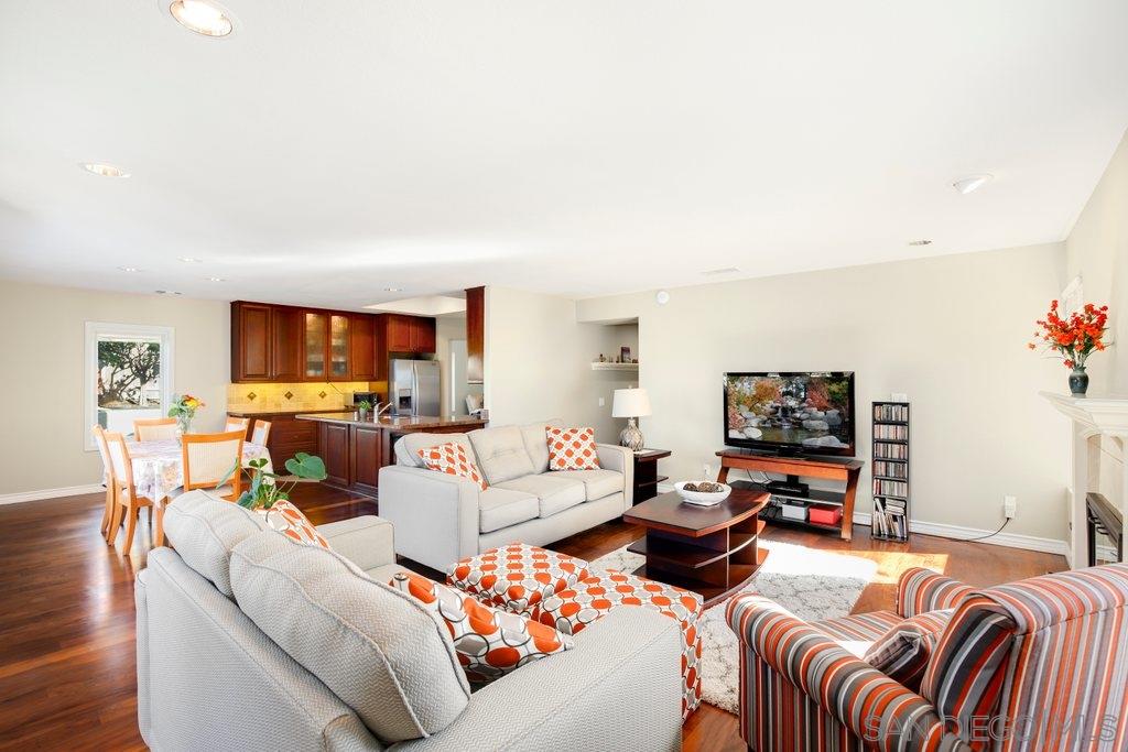 5058 Frazee Road Oceanside, CA 92057 - Photo 9 of 25 a living room with furniture and a flat screen tv