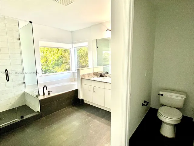 a bathroom with a bathtub sink and toilet