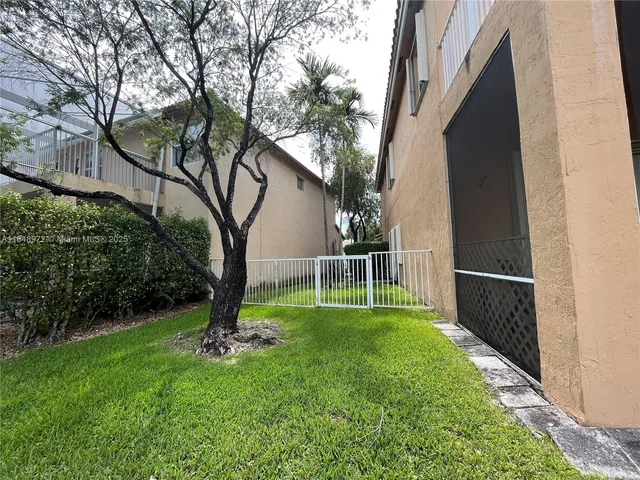 a view of a backyard with a small cabin