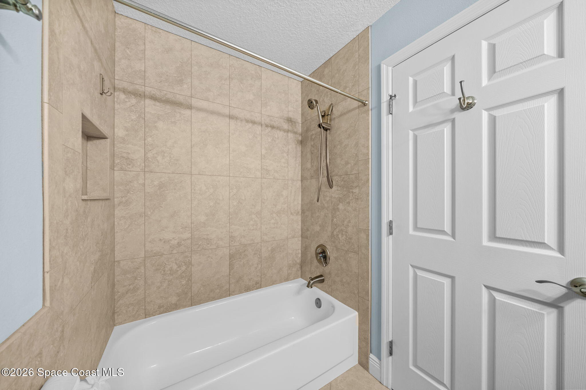 1236 Walnut Grove Way Rockledge, FL 32955 - Photo 18 of 43 a bathroom with a bathtub