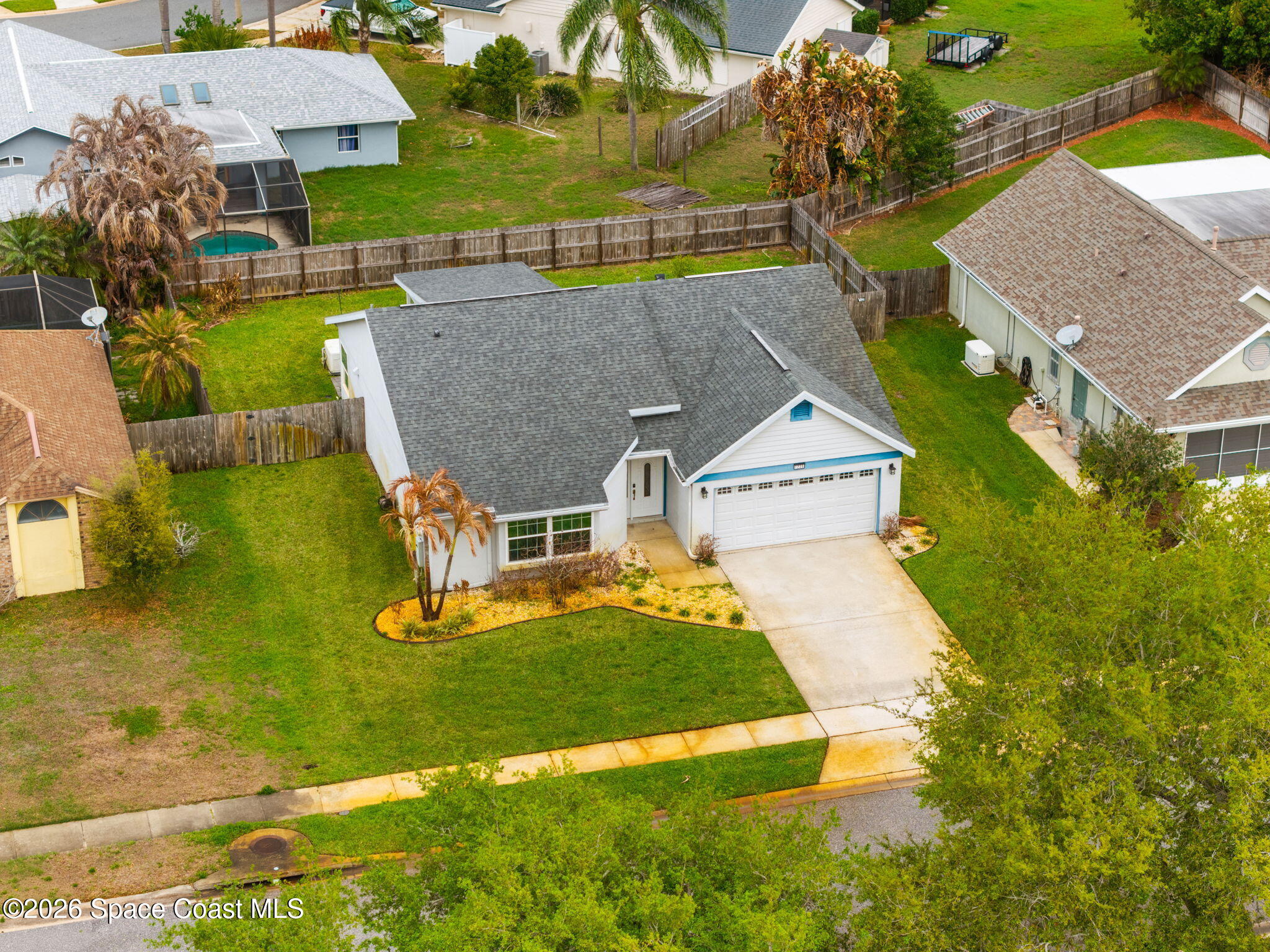 1236 Walnut Grove Way Rockledge, FL 32955 - Photo 2 of 43 an aerial view of a house with swimming pool