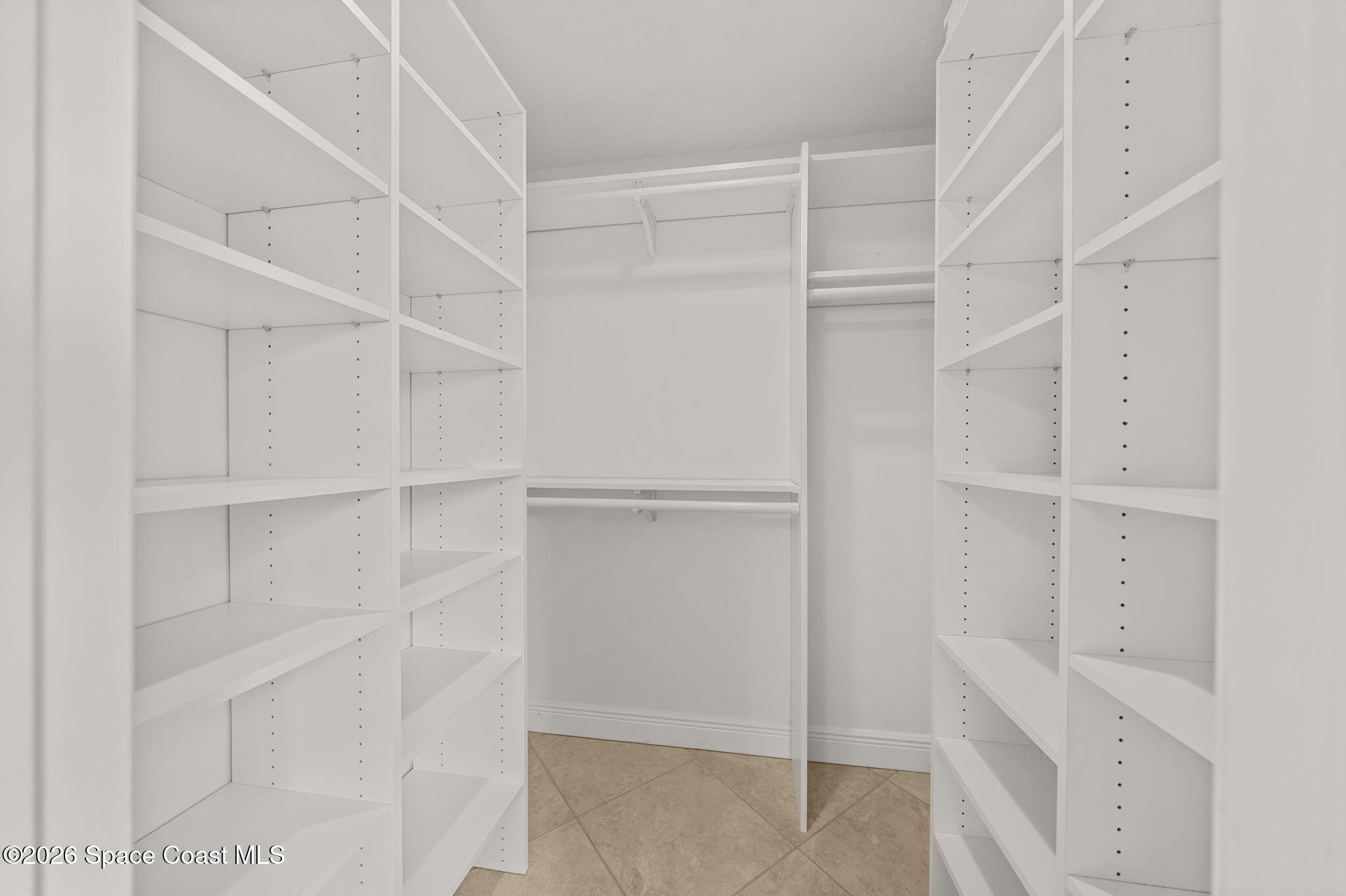1236 Walnut Grove Way Rockledge, FL 32955 - Photo 21 of 43 a view of walk in closet