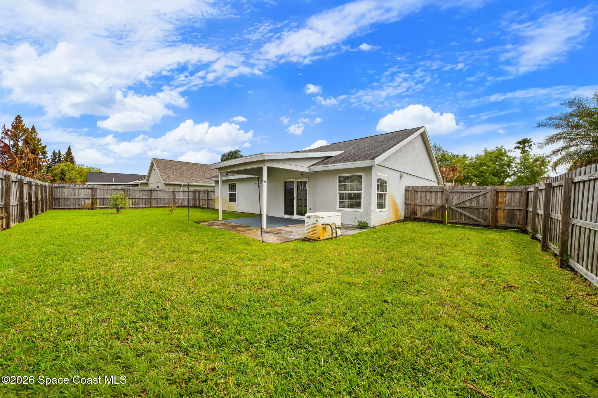 1236 Walnut Grove Way Rockledge, FL 32955 - Photo 27 of 43 a view of a house with backyard and sitting area