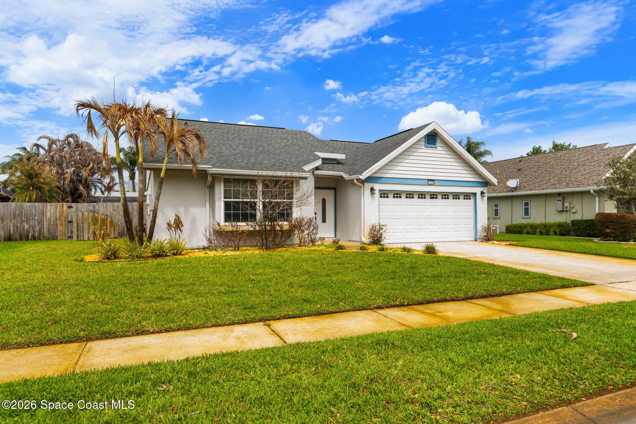1236 Walnut Grove Way Rockledge, FL 32955 - Photo 41 of 43 a front view of a house with a yard
