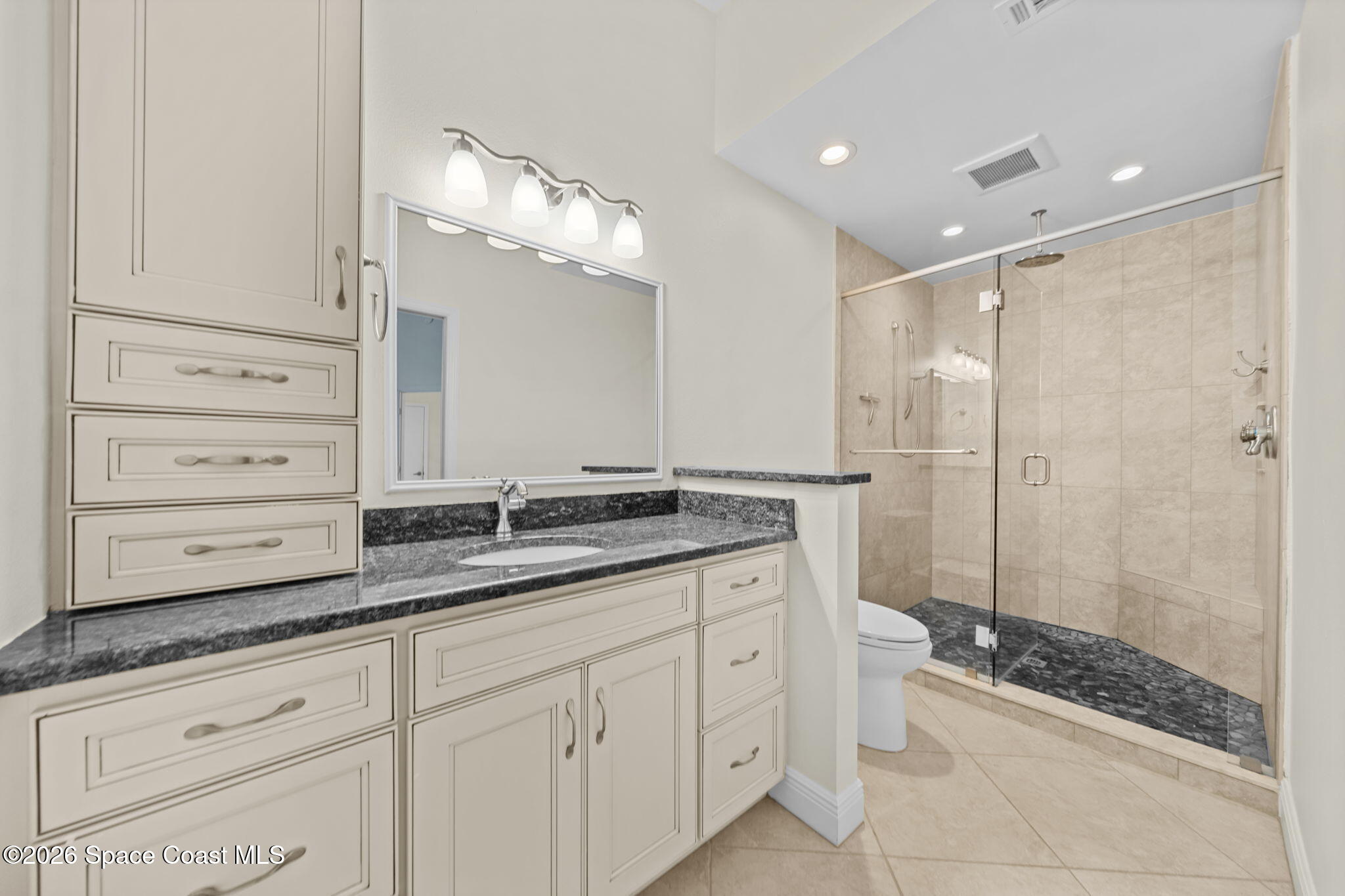1236 Walnut Grove Way Rockledge, FL 32955 - Photo 5 of 43 a bathroom with a granite countertop sink mirror and shower