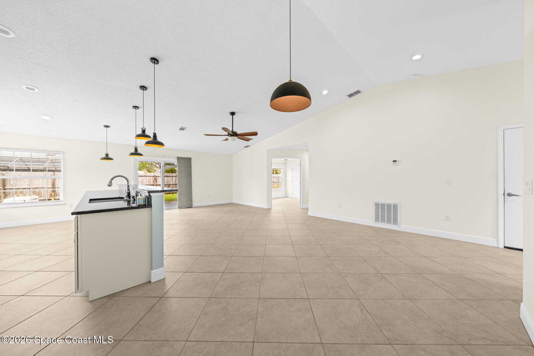 1236 Walnut Grove Way Rockledge, FL 32955 - Photo 8 of 43 a kitchen with kitchen island a counter top space appliances and cabinets