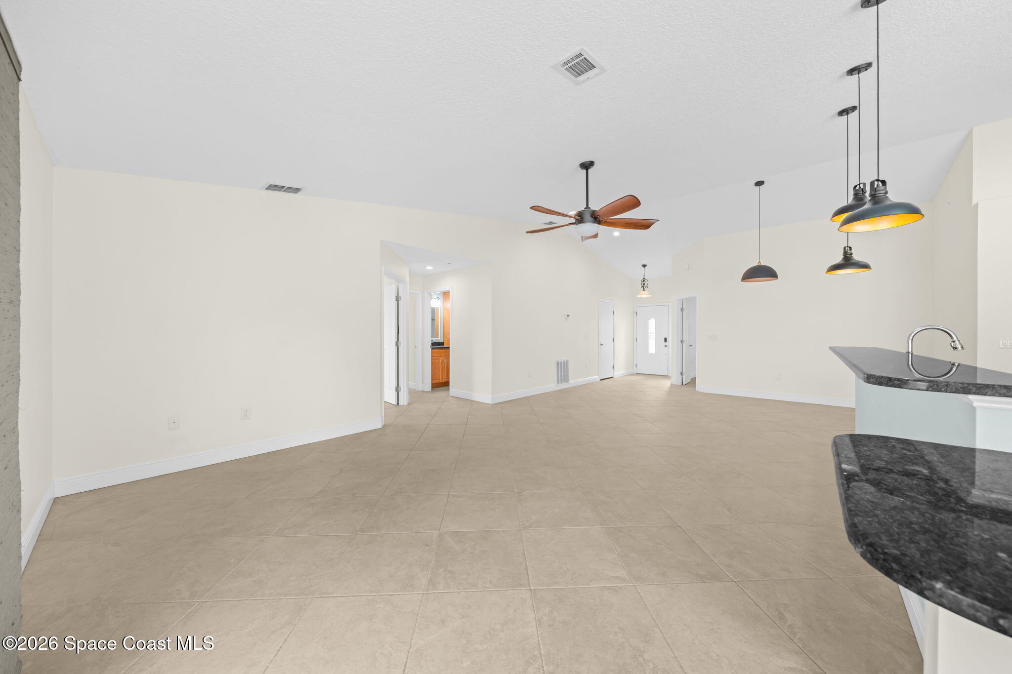 1236 Walnut Grove Way Rockledge, FL 32955 - Photo 10 of 43 a view of a living room and chandelier fan