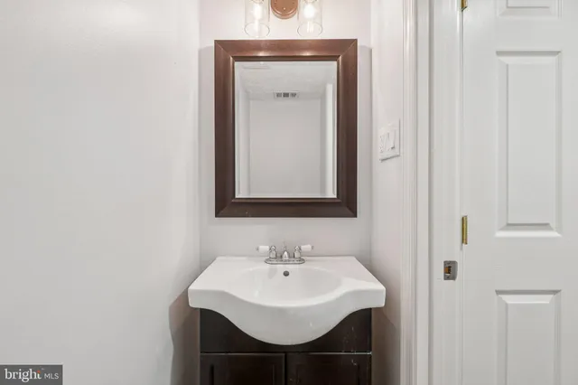 a view of a hallway with entryway door